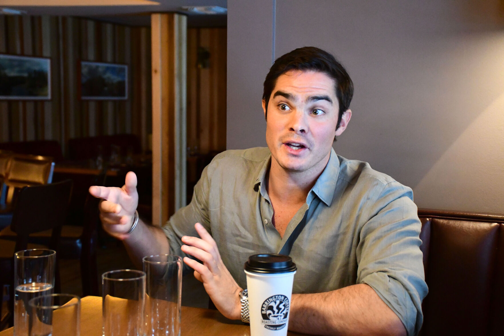 Salama speaks from inside Firefly Gastropub